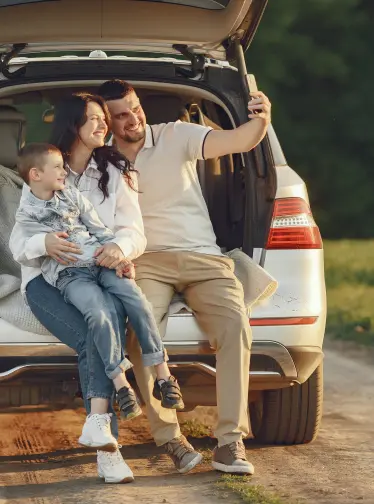 Happy family with their car - professional auto repair service